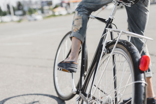 Man sitting on bicycle at outdoors