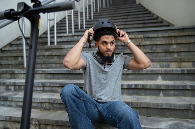 Man sitting on stairs with headphones