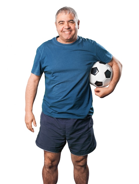 Man smiling with a football in his hands