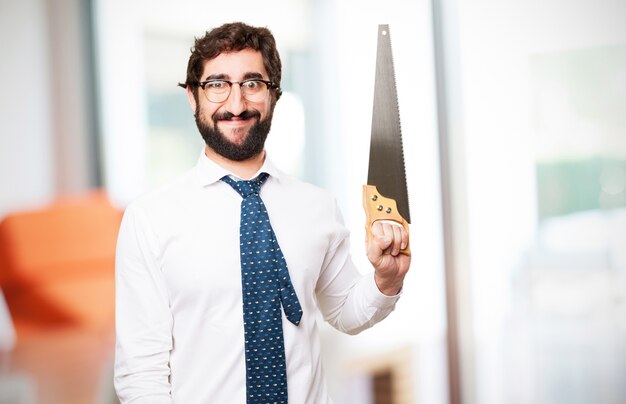 Man smiling with a saw