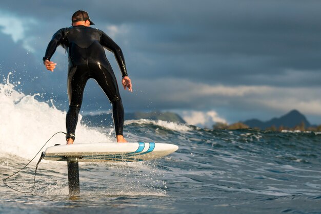 Man in special equipment surfing in hawaii