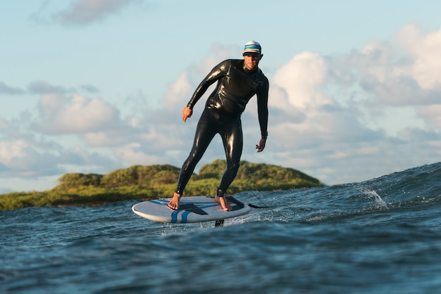 Man in special equipment surfing in hawaii