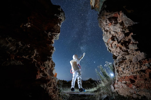 Man in special white space suit exploring stars