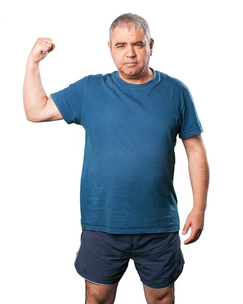 Man squeezing the muscles of an arm