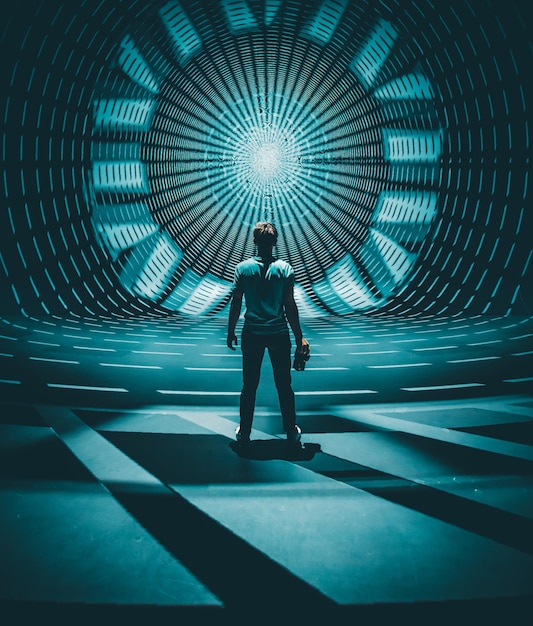 Free Photo man standing in front of symmetrical light projection