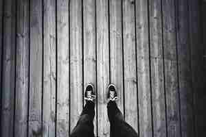 Free photo man standing on the old wooden floor.