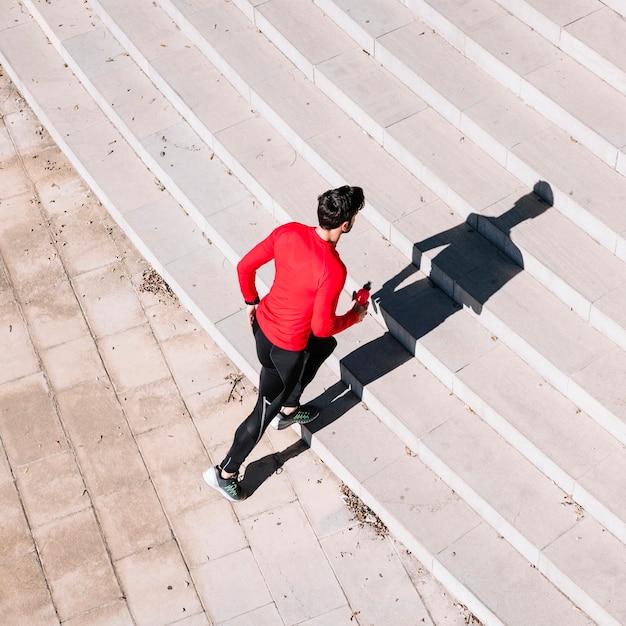 Man starting to run upstairs