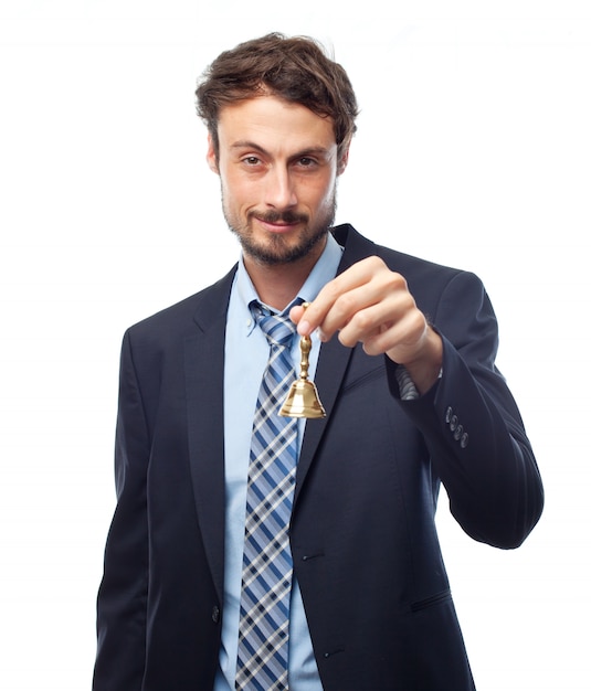 Man in suit holding a golden bell