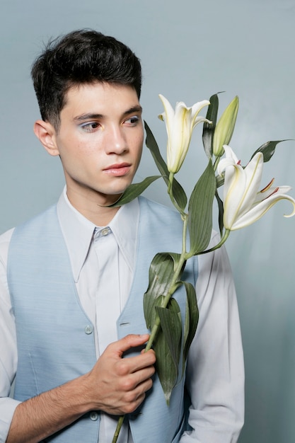 Man in suit holding lily