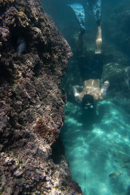 Man swimming under the ocean