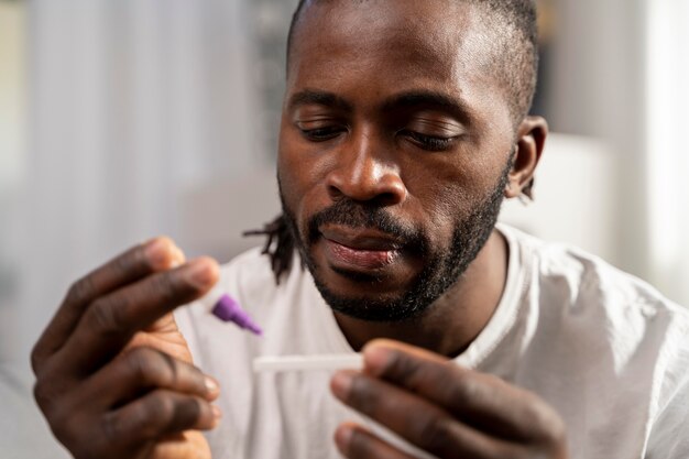 Man taking a covid test alone at home