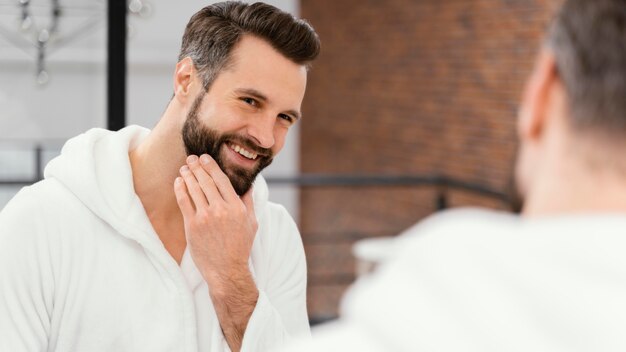 Man taking good care of his face at home