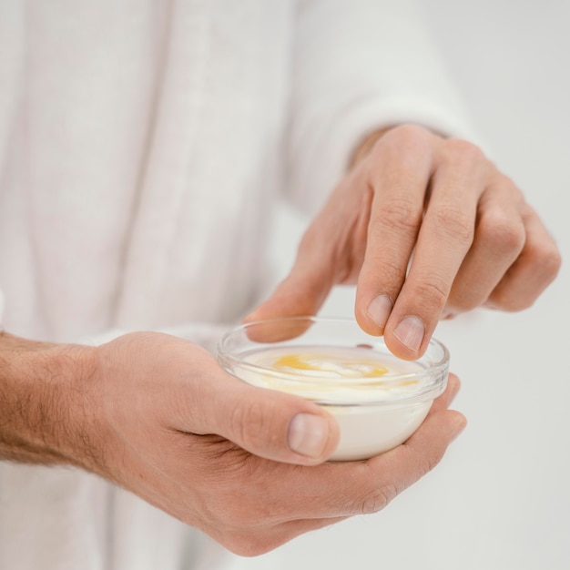 Man taking good care of his face at home