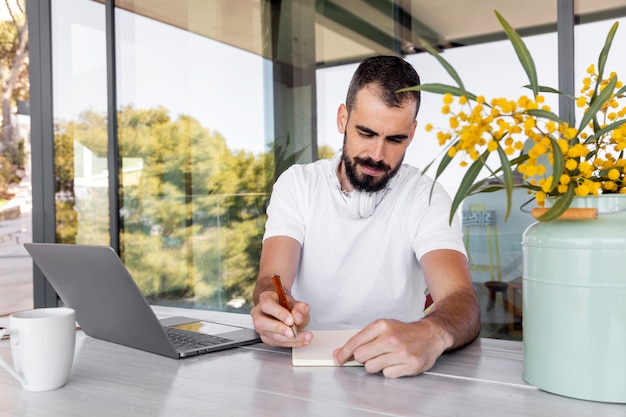 Man taking notes medium shot