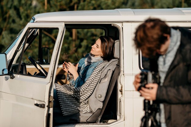 Man taking a photo with a retro camera