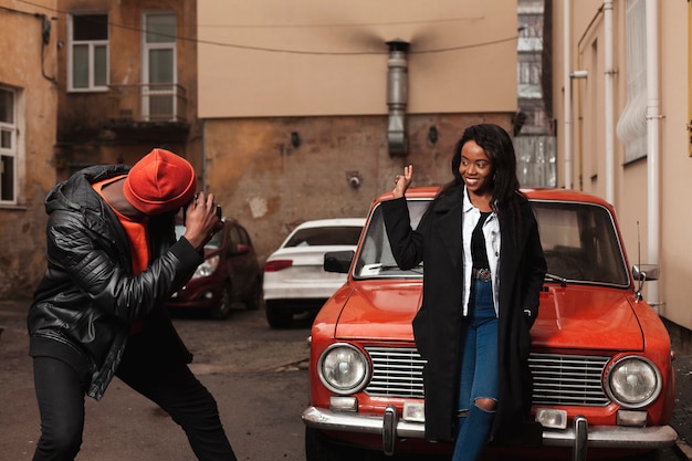 Man taking photo of woman