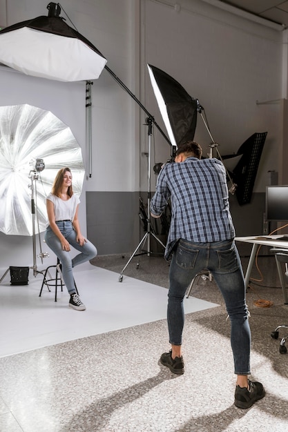 Man taking photos of beautiful model