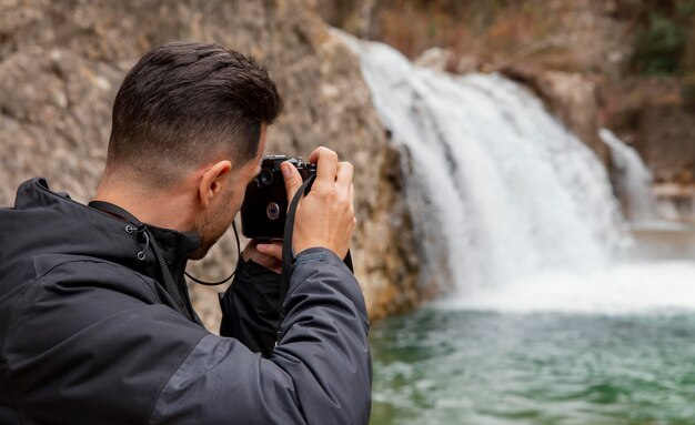 Man taking photos of nature