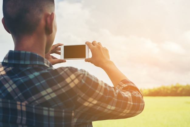 Man taking a picture of the field