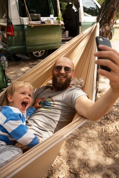 Man taking selfie with kid high angle