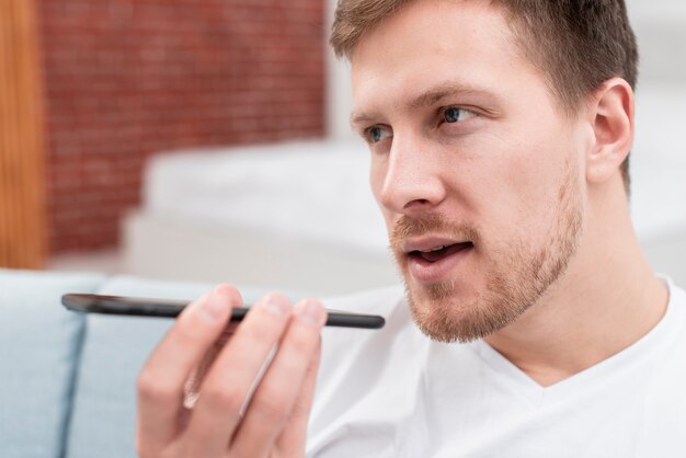 Man talking to someone with speaker on