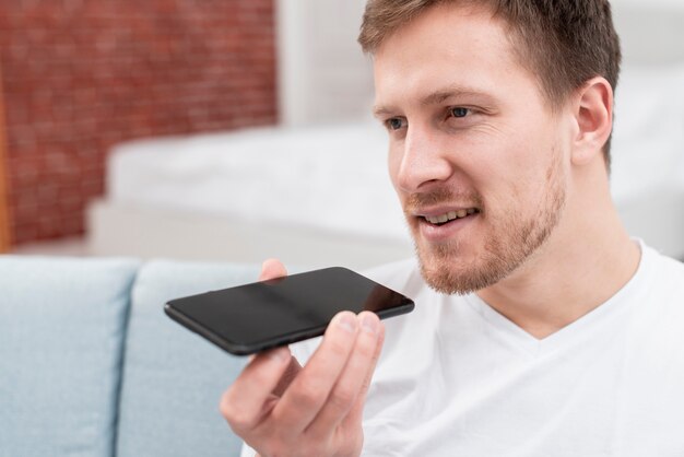 Man talking with his phone assistant