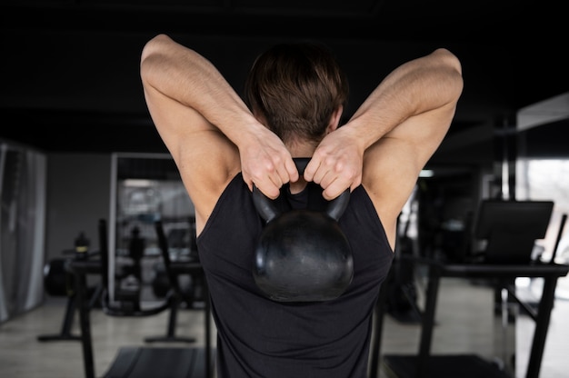 Man training with weight lifting