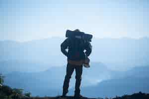 Free photo man traveler with backpack mountaineering travel lifestyle concept