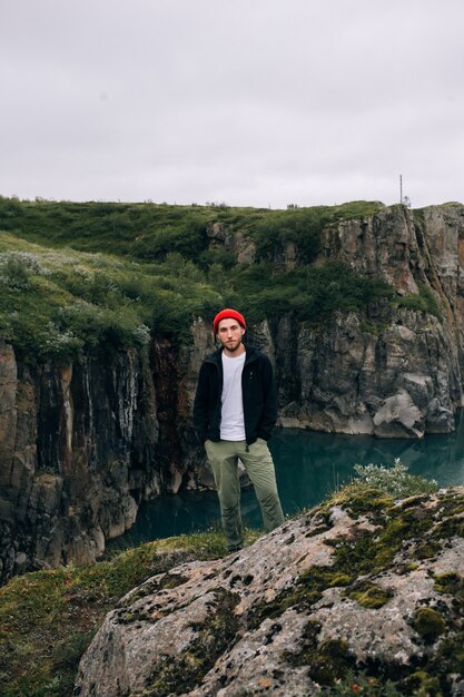 Man traveller walk arund icelandic landscape