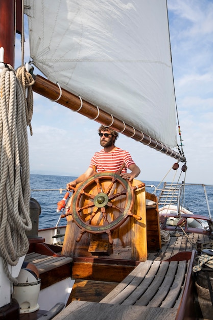 Free Photo man travelling by boat in san sebastian