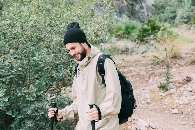 Free photo man trekking in mountains