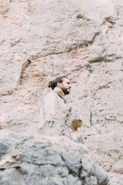 Free photo man trekking in mountains