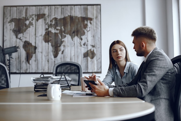 Man uses a tablet . Business partners at a business meeting.People are sitting at the table