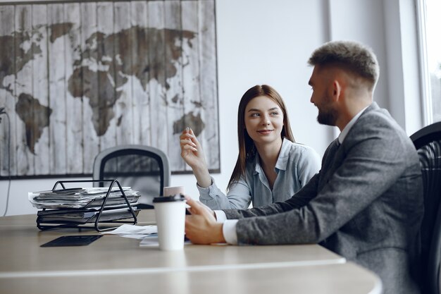 Man uses a tablet . Business partners at a business meeting.People are sitting at the table