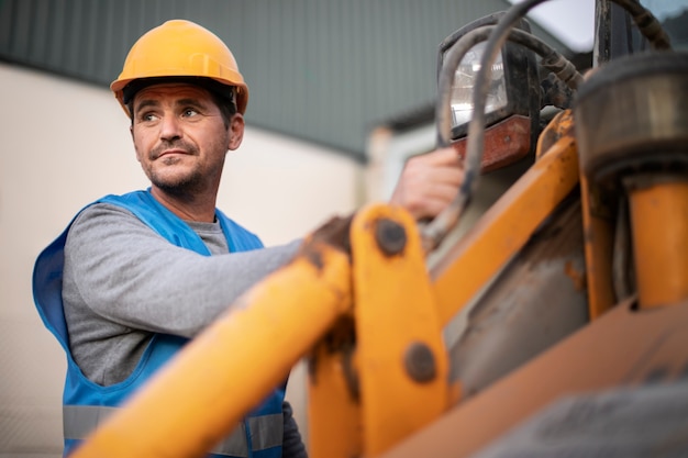 Man using an excavator for digging on day light