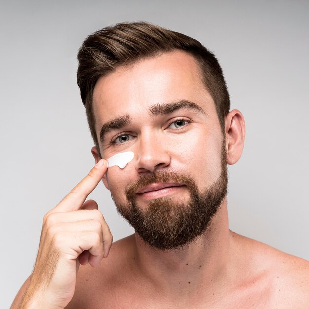 Man using face cream