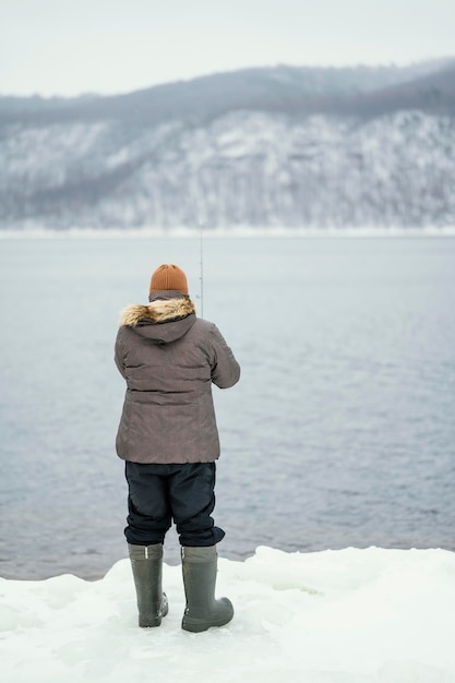 Free Photo man using a fishing rod