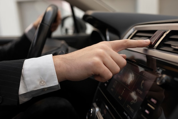 Man using his car's options while driving