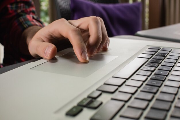 Man using laptop in bar