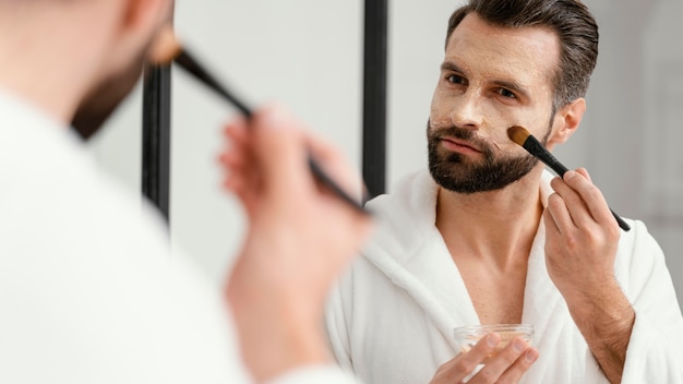 Man using natural ingredients for a face mask