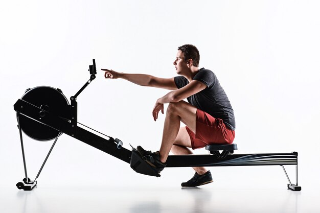 Man Using A Press Machine In A Fitness Club.