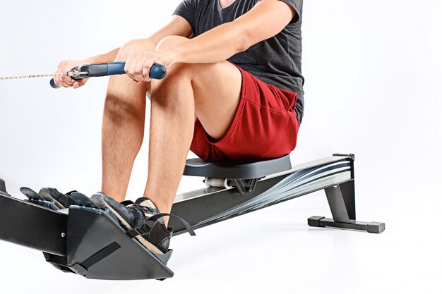 Man Using A Press Machine In A Fitness Club.