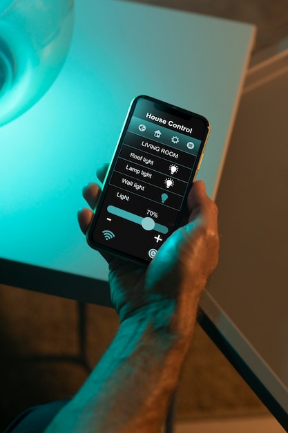 Man using a smartphone in his automated home