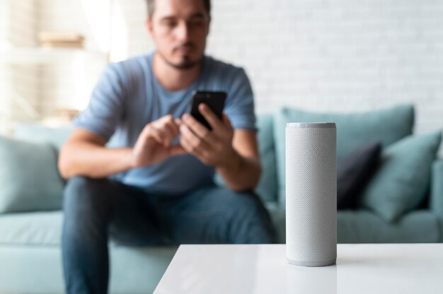 Man using a speaker digital assistant