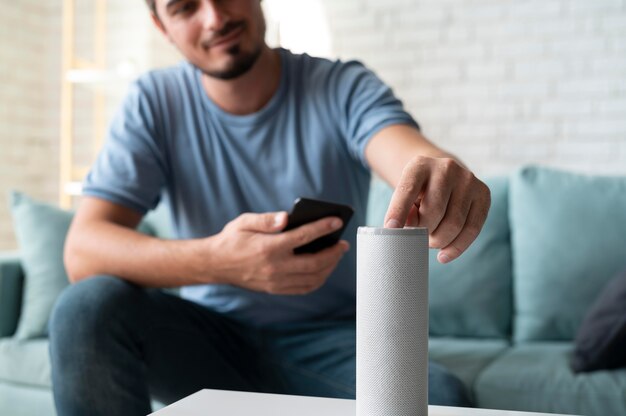 Man using a speaker digital assistant