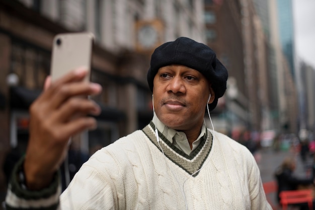 Man using technology while traveling in the city