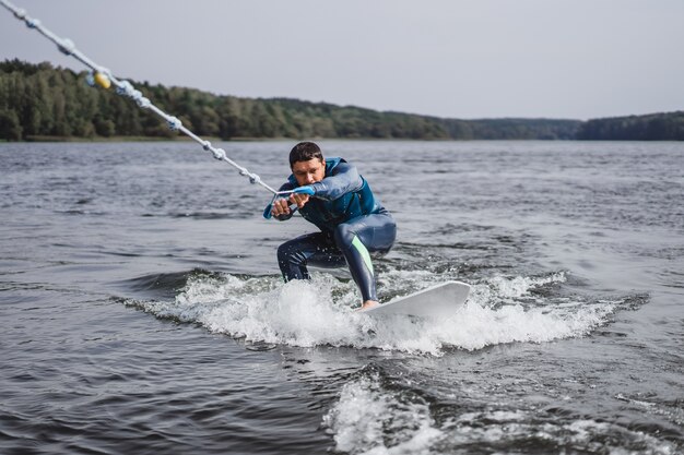 man on wakesurfing. wave from the boat.