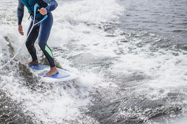 man on wakesurfing. wave from the boat.