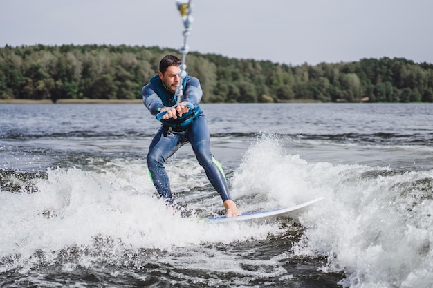 Free Photo man on wakesurfing. wave from the boat.