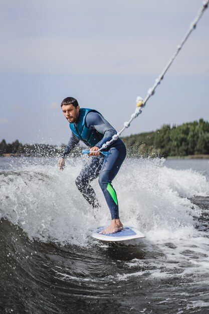 man on wakesurfing. wave from the boat.